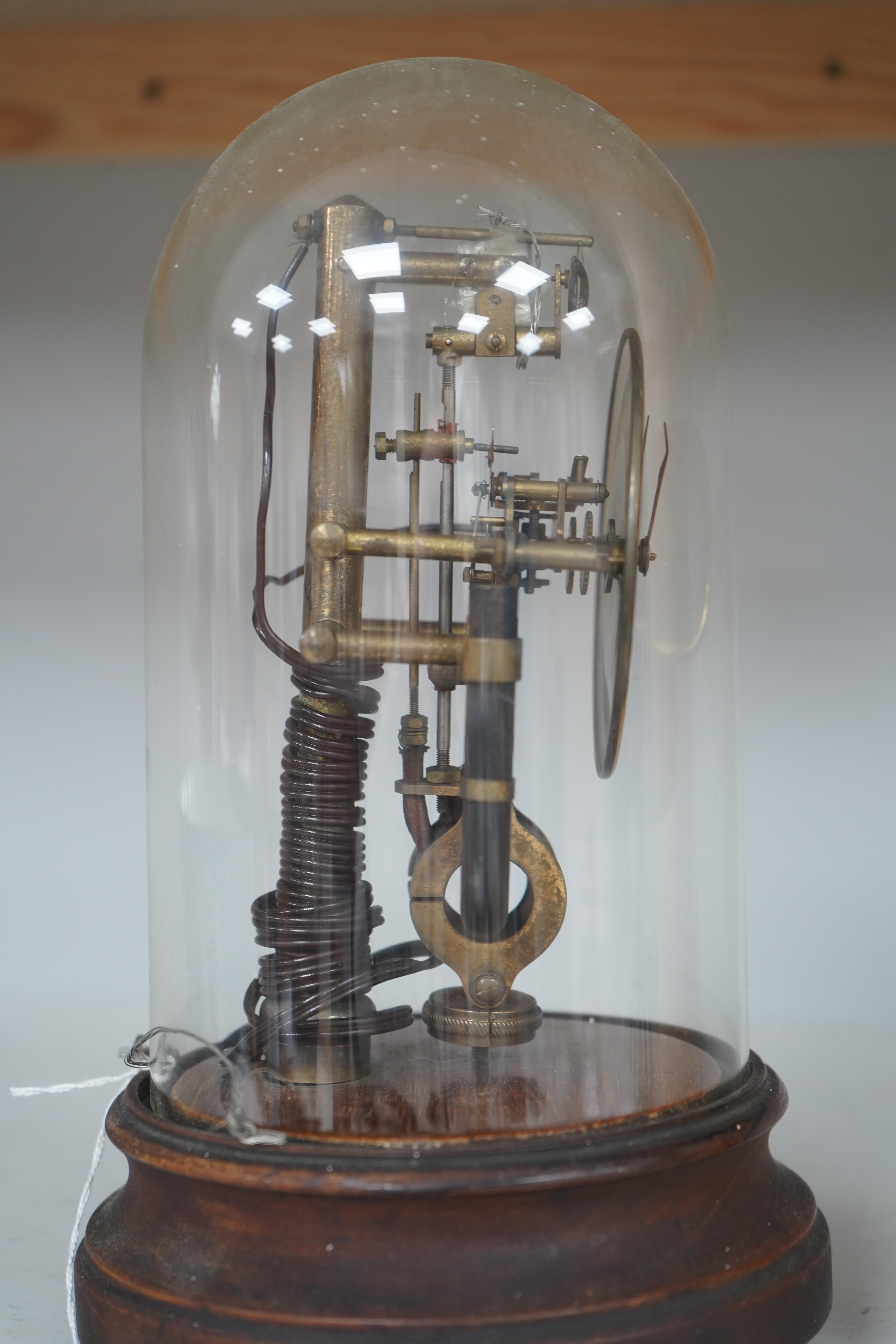 A Bulle type 800 day electric clock, under a glass dome, 26cm high. Condition - fair, untested